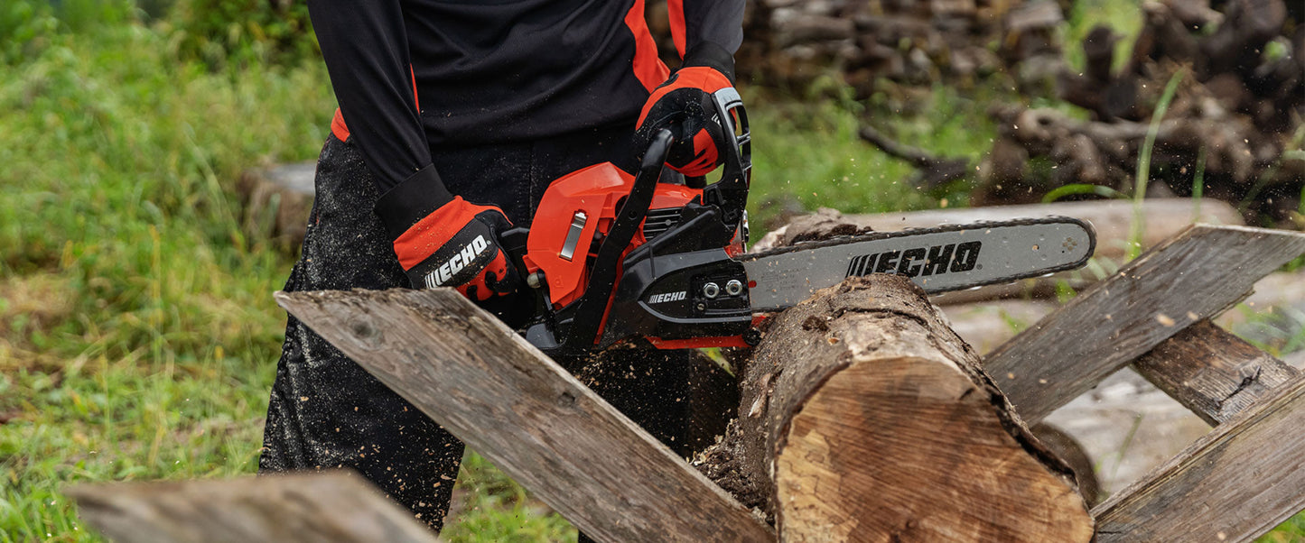 Echo chainsaw in use cutting a log