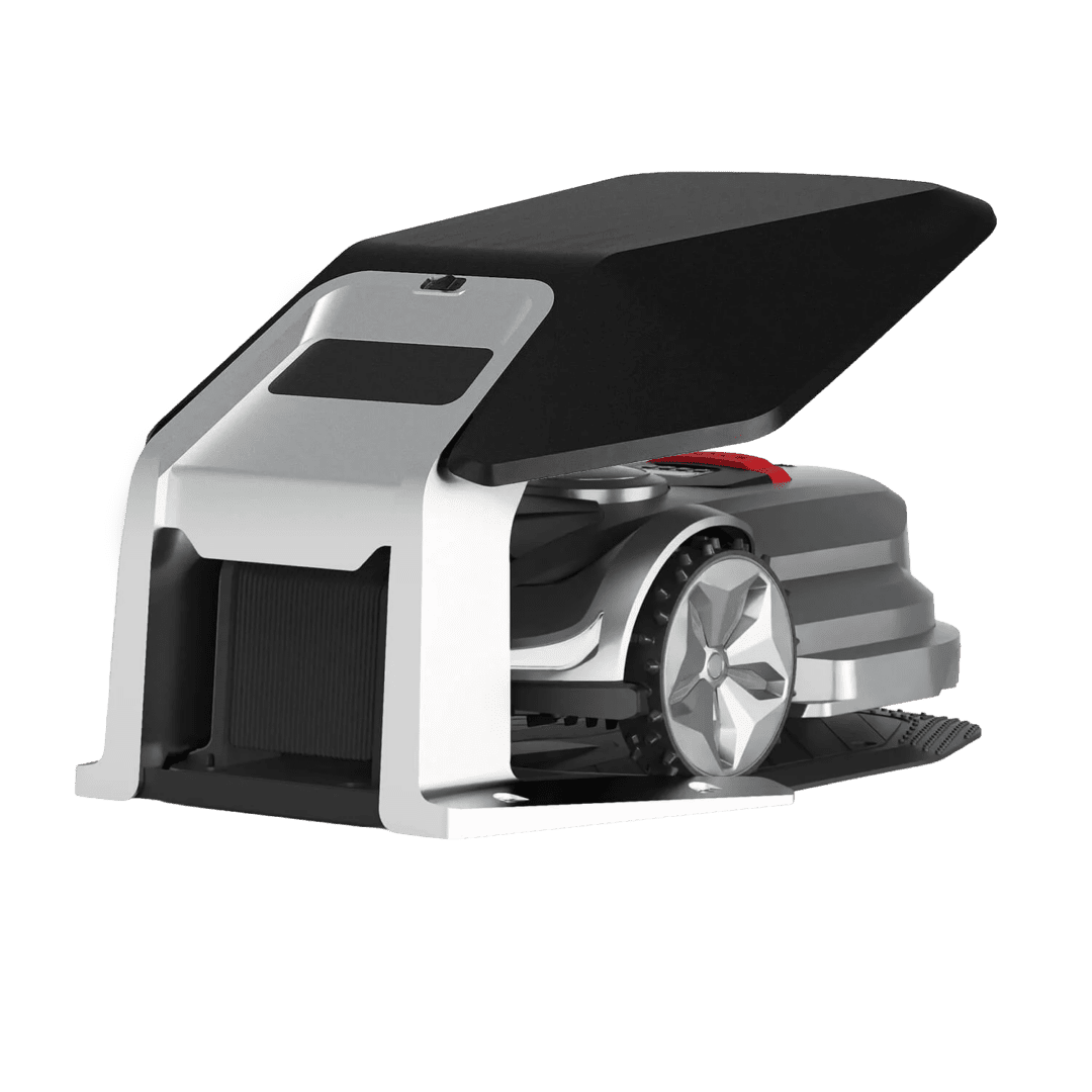 A robotic lawn mower with a top cover showing the internal brush bar and wheel, set against a solid green background.