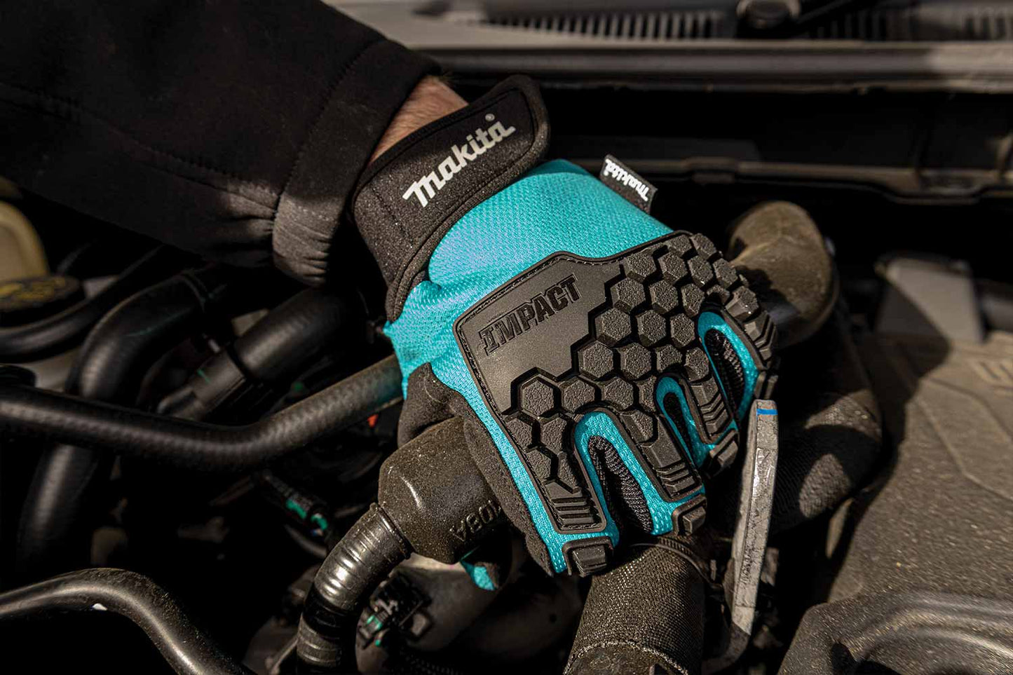 Makita gloves in use while checking a car engine