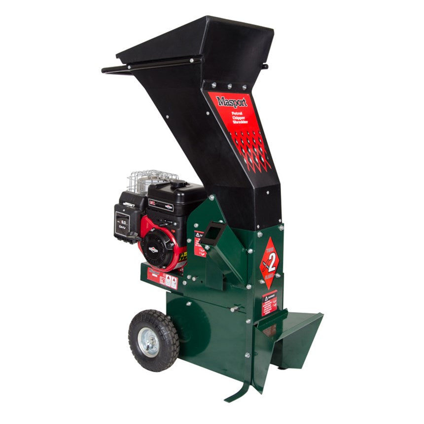 A Masport chipper shredder with a Briggs & Stratton engine, featuring a large green hopper and a black chipping mechanism. The machine has large wheels for mobility and is equipped with a bar grate accessory.