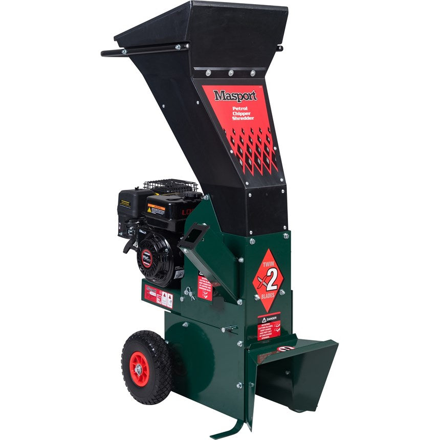Masport Chipper Shredder with a green body, black accents, and a red safety label, featuring large wheels and a heavy steel frame.