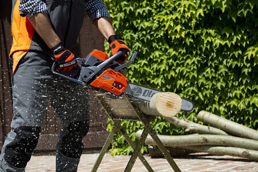 Oleo-mac Chainsaw in use